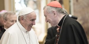 VATICAN CITY, VATICAN - DECEMBER 22: Pope Francis exchanges Christmas greetings with Vatican Secretary of State cardinal Pietro Parolin at the Clementina Hall on December 22, 2016 in Vatican City, Vatican. Pope Francis invited the Roman Curia to embrace the process of reform, telling them Christmas is 'the feast of the loving humility of God, of the God who upsets our logical expectations, the established order'. (Photo by Vatican Pool/Getty Images)
