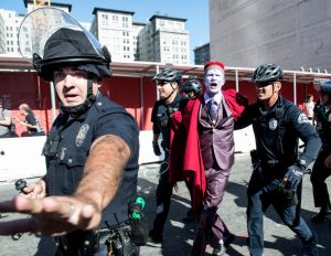 A protester is taken into custody by LAPD officers during "This Nightmare Must End: the Trump/Pence Regime Must Go!" protest in downtown Los Angeles on Saturday, Nov. 4, 2017. (Photo by Ed Crisostomo, Los Angeles Daily News/SCNG)