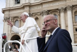 Domenico Giani, lead bodyguard for Pope Francis and head of the Vatican police force, keeps watch as the pope leaves his general audience in St. Peter's Square at the Vatican May 1, 2019. Pope Francis accepted the resignation of Giani Oct. 14, nearly two weeks after an internal security notice was leaked to the Italian press. (CNS photo/Paul Haring) See POPE-GIANI-RESIGNATION Oct. 14, 2019.
